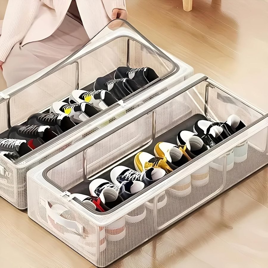 Two clear-lid under-bed boxes filled with sneakers on a wooden floor